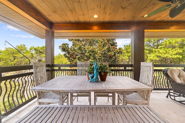 wooden terrace featuring ceiling fan