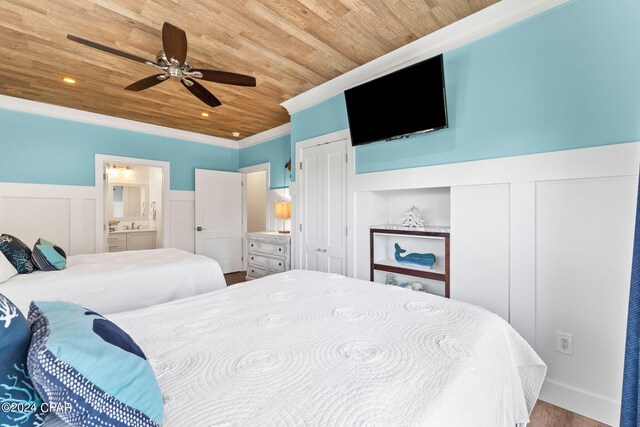 bedroom featuring wood ceiling, ceiling fan, ensuite bathroom, hardwood / wood-style flooring, and ornamental molding