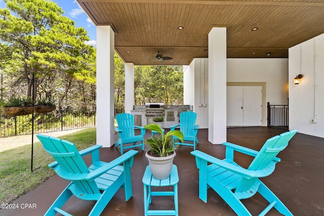 view of patio / terrace with ceiling fan, an outdoor kitchen, and a grill