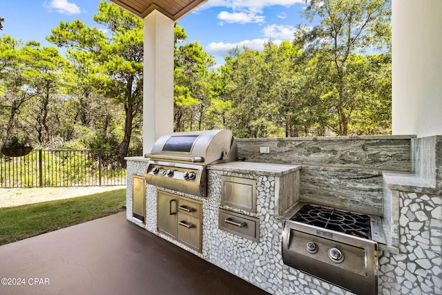 view of patio / terrace featuring area for grilling and a grill