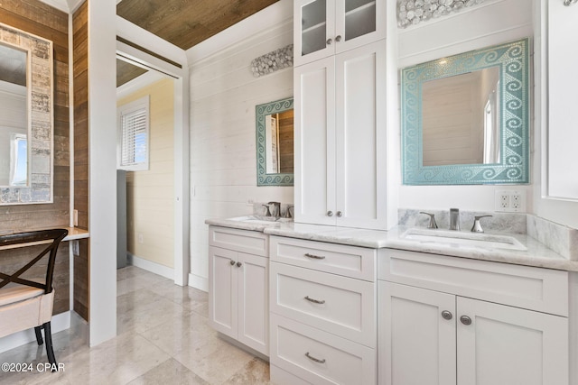 bathroom with vanity and crown molding