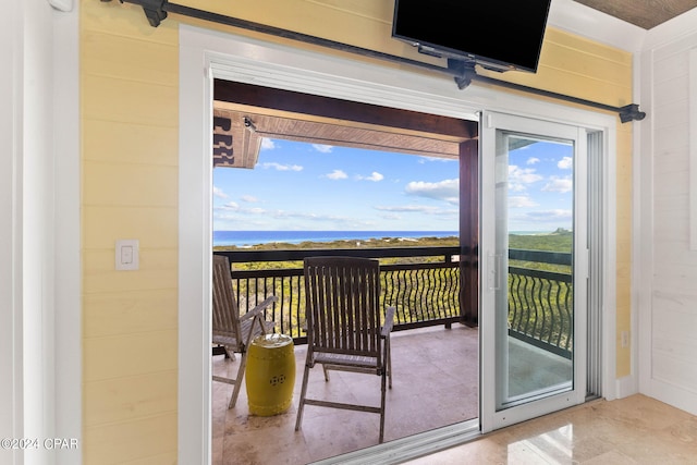 doorway to outside with a water view