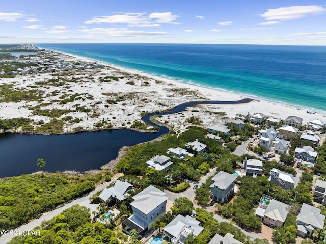 aerial view featuring a view of the beach and a water view