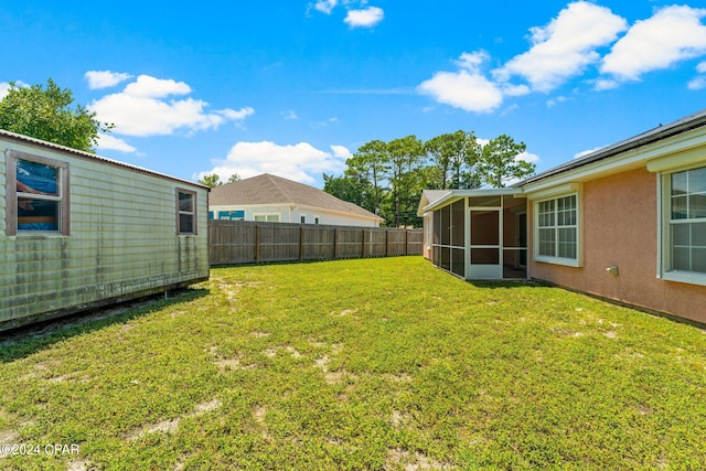 view of yard featuring a sunroom