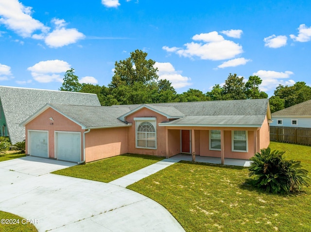 single story home with a garage and a front yard