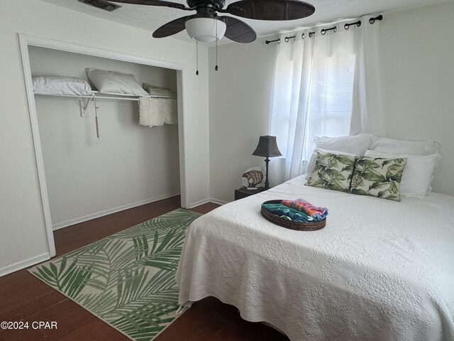 bedroom featuring a closet, hardwood / wood-style floors, and ceiling fan