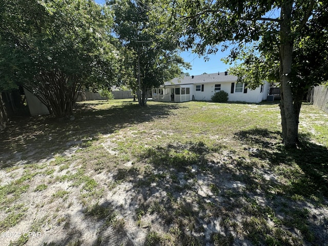 view of yard with a sunroom