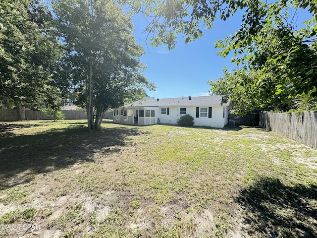 view of yard with a sunroom