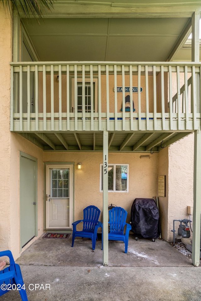 view of patio with a balcony and area for grilling