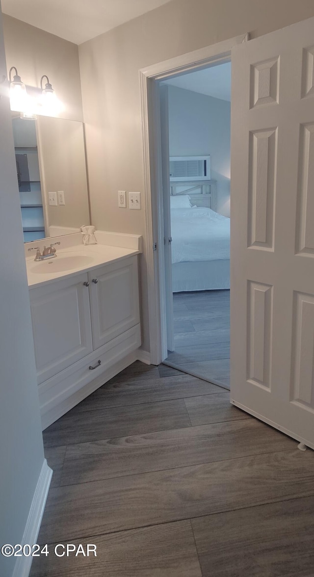 bathroom featuring vanity and wood-type flooring