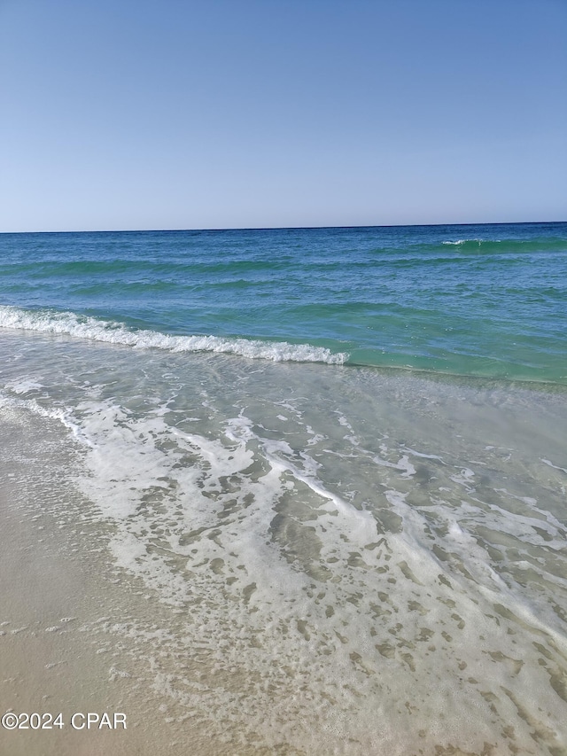 view of water feature with a beach view