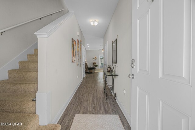 hallway with hardwood / wood-style floors