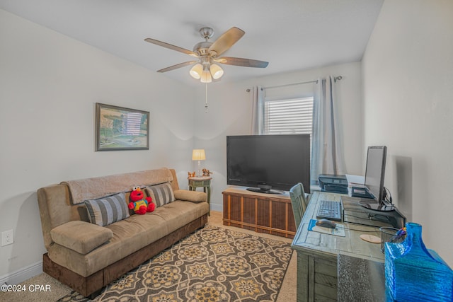 carpeted living room with ceiling fan