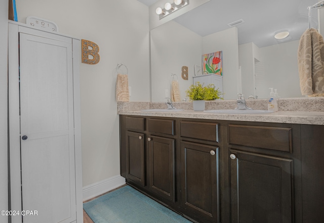 bathroom featuring double sink vanity