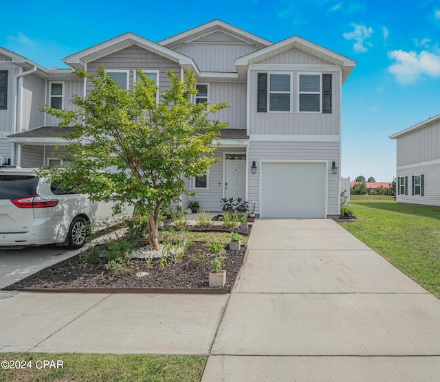 view of front facade with a garage and a front yard