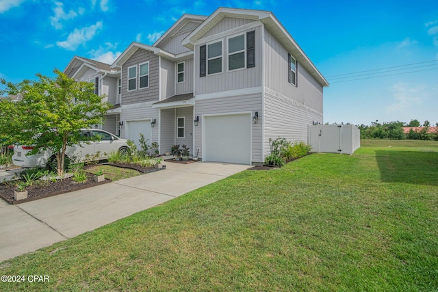 view of front of house featuring a garage and a front lawn