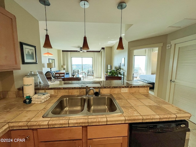 kitchen with dishwasher, ceiling fan, sink, kitchen peninsula, and decorative light fixtures