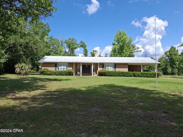 ranch-style house with a front yard