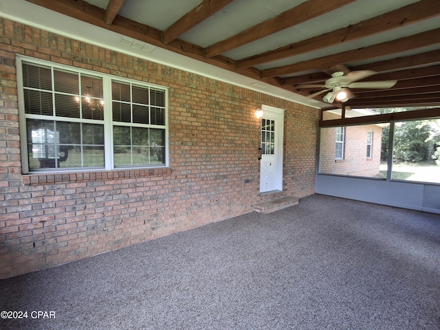 exterior space with ceiling fan