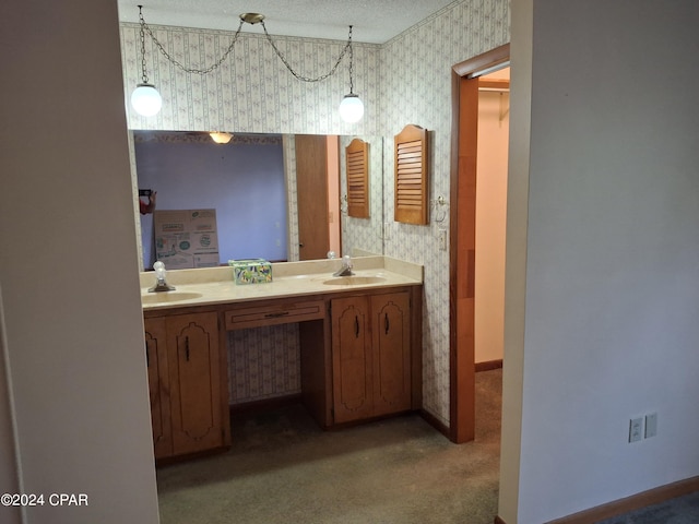 bathroom featuring vanity and a textured ceiling