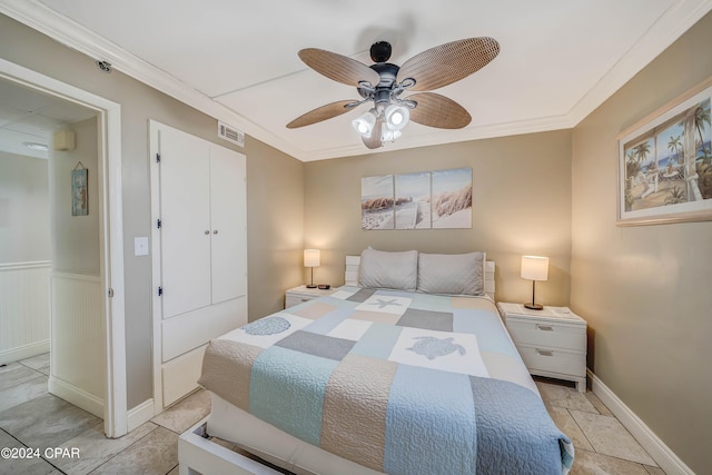 bedroom with ceiling fan and ornamental molding