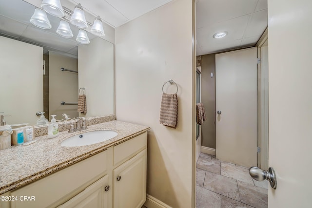 bathroom with shower / bath combination with glass door and vanity