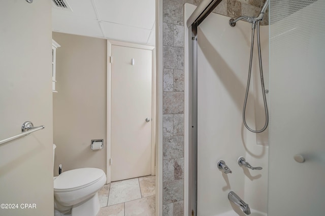 bathroom featuring tile patterned floors, toilet, and an enclosed shower