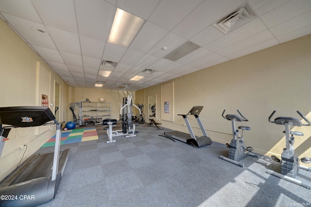 exercise room with a drop ceiling