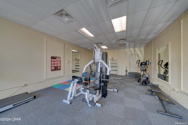 exercise room featuring a paneled ceiling