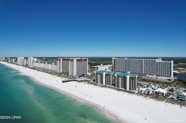 aerial view featuring a view of the beach and a water view