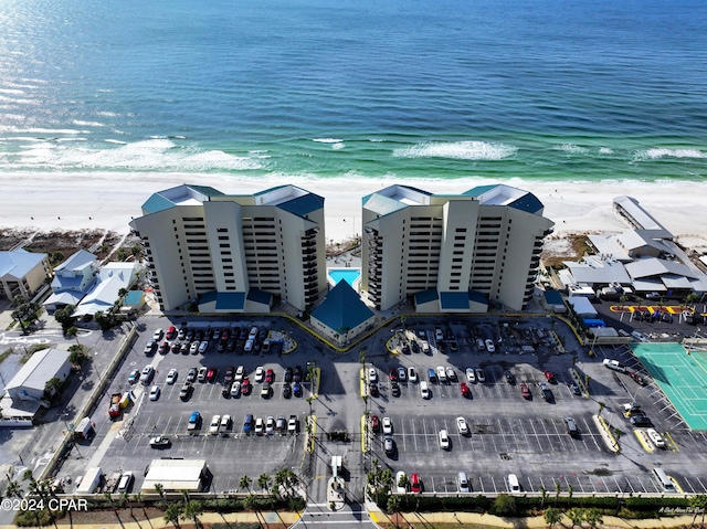 bird's eye view featuring a water view and a view of the beach