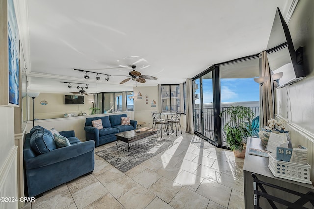 living room featuring ceiling fan, expansive windows, and rail lighting