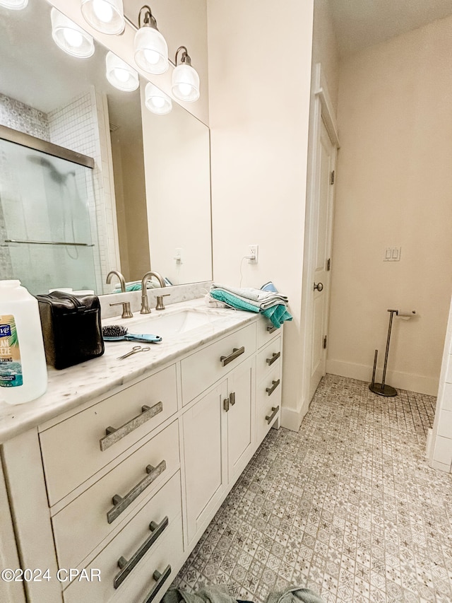 bathroom with tile patterned flooring and vanity