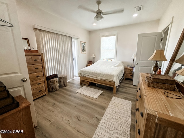 bedroom featuring ceiling fan and hardwood / wood-style flooring