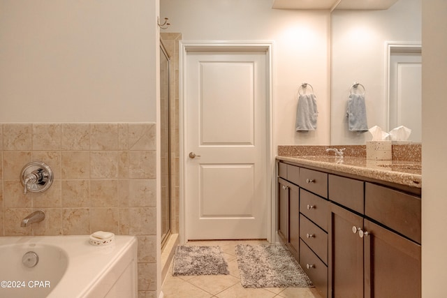 bathroom with vanity, shower with separate bathtub, and tile patterned floors