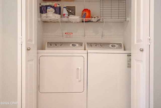 laundry room featuring washing machine and clothes dryer