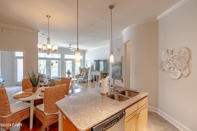 kitchen featuring dishwasher, crown molding, a kitchen island with sink, sink, and a notable chandelier