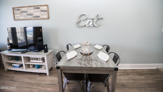 dining space featuring hardwood / wood-style floors