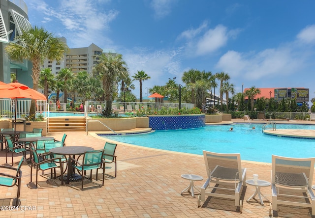 view of swimming pool with a patio area