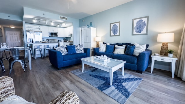 living room with hardwood / wood-style flooring