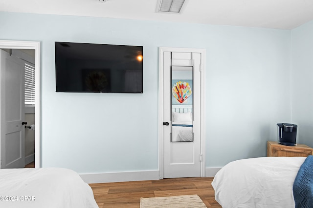 bedroom featuring hardwood / wood-style floors