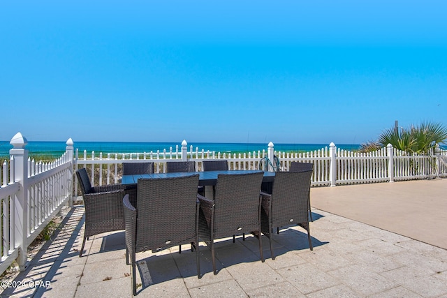 view of patio with a water view