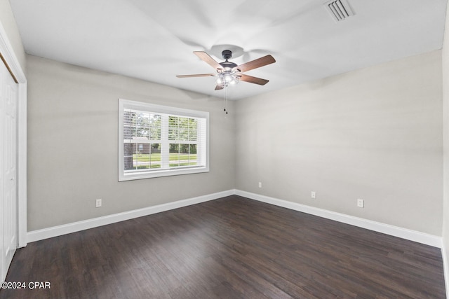 unfurnished bedroom featuring a closet, ceiling fan, and dark hardwood / wood-style flooring