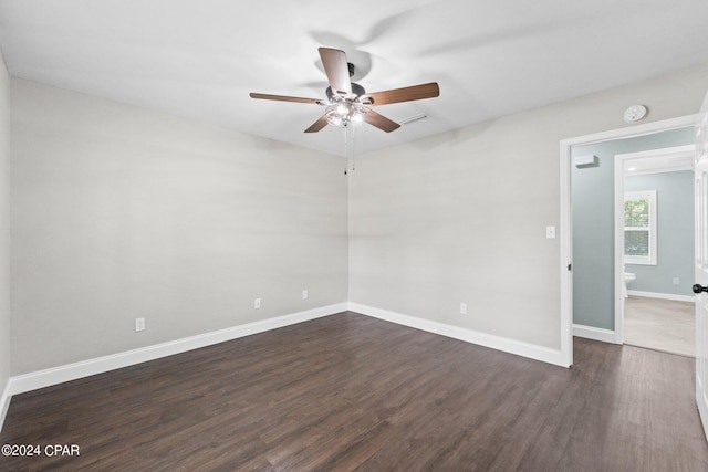 unfurnished room featuring dark hardwood / wood-style flooring and ceiling fan