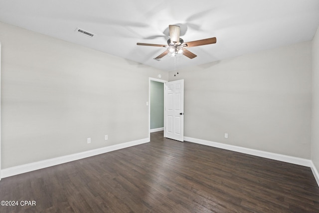 unfurnished room featuring ceiling fan and dark wood-type flooring