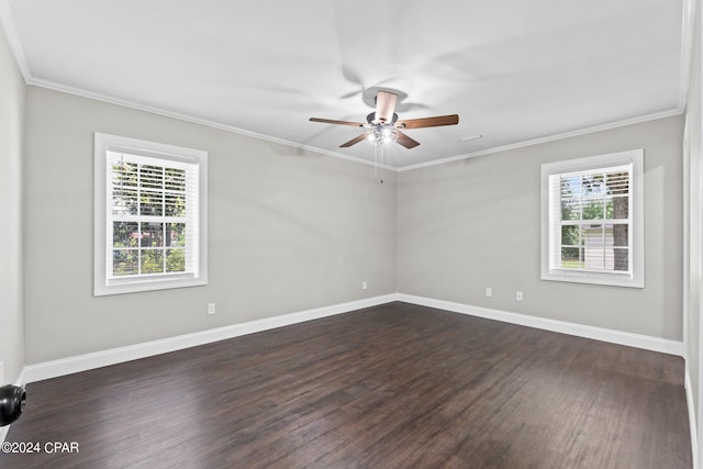 empty room with ceiling fan, dark wood-type flooring, and ornamental molding