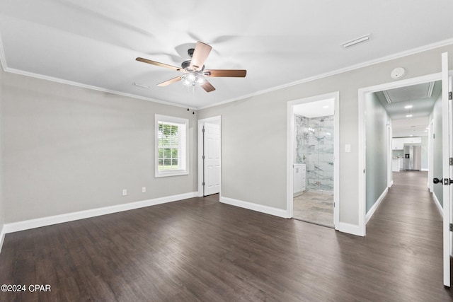 unfurnished room featuring ceiling fan, dark hardwood / wood-style flooring, and ornamental molding