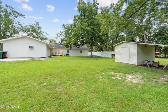 view of yard with a storage unit