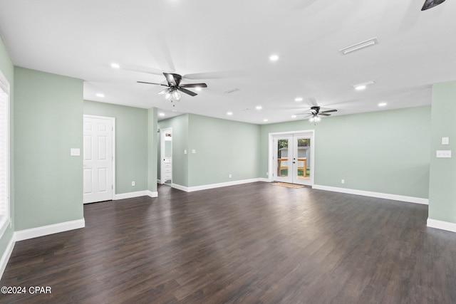 spare room with french doors, ceiling fan, and dark wood-type flooring