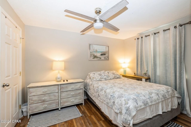 bedroom with dark wood-style floors and ceiling fan